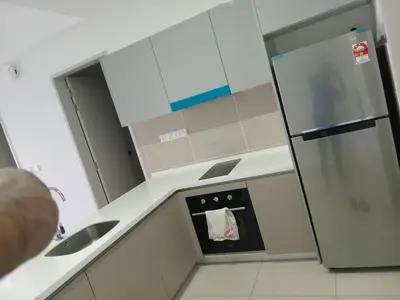 a small kitchen with a sink and an oven at Trion Kuala Lumpur by DSM in Kuala Lumpur