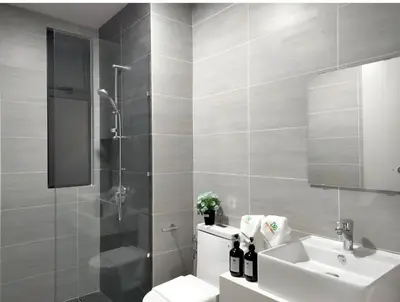 a bathroom with a toilet and a sink and a shower at Trion Kuala Lumpur by DSM in Kuala Lumpur
