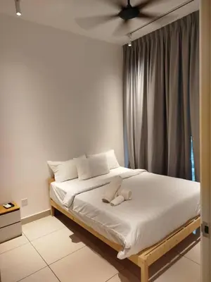 a bedroom with a bed with a stuffed animal on it at Trion Kuala Lumpur by DSM in Kuala Lumpur