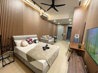 a bedroom with a bed and a tv and a couch at The Pano at Jalan Ipoh Near KLCC By The Homez in Kuala Lumpur