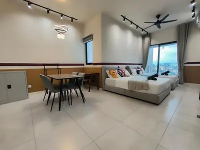 a bedroom with a bed and a table and chairs at The Pano at Jalan Ipoh Near KLCC By The Homez in Kuala Lumpur