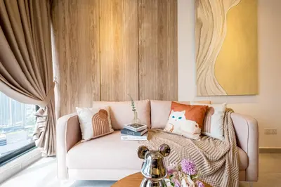 a living room with a couch and a table at Agile Bukit Bintang by Feel Home in Kuala Lumpur