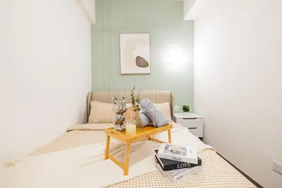 a room with a bed with a table on it at Agile Bukit Bintang by Feel Home in Kuala Lumpur
