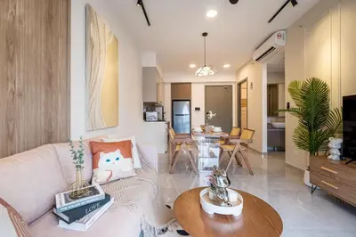 a living room with a couch and a table at Agile Bukit Bintang by Feel Home in Kuala Lumpur