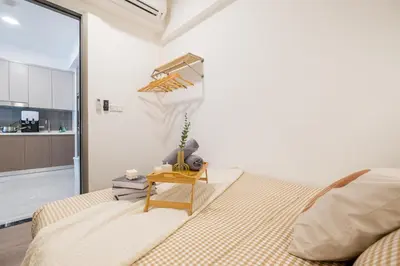 a bedroom with a bed and a table at Agile Bukit Bintang by Feel Home in Kuala Lumpur