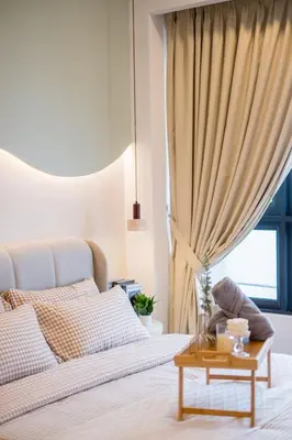 a bedroom with a bed with a table and a window at Agile Bukit Bintang by Feel Home in Kuala Lumpur