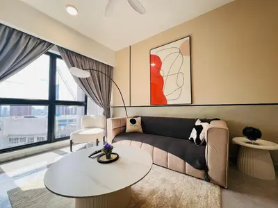 a living room with a couch and a table at Agile Bukit Bintang by DeUrban in Kuala Lumpur