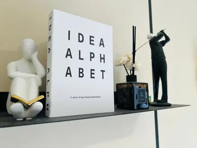 a shelf with a book and a mannequin and a statue at Agile Bukit Bintang by DeUrban in Kuala Lumpur