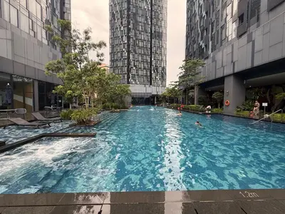 a swimming pool in a city with tall buildings at Star Residence KL in Kuala Lumpur