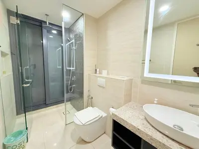 a bathroom with a shower and a toilet and a sink at Star Residence KL in Kuala Lumpur