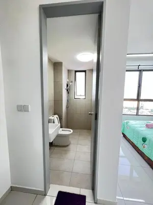 a bathroom with a toilet and a bed in it at Cozy Kenwingston Platz KL 2-5 Pax2BR & 2BR FrePakin Netflix 3803 in Kuala Lumpur