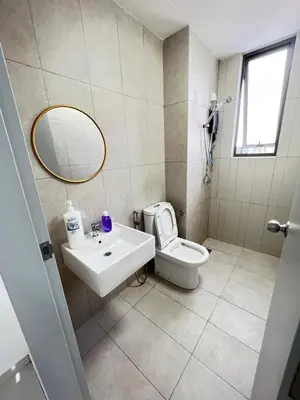 a bathroom with a sink and a toilet and a mirror at Cozy Kenwingston Platz KL 2-5 Pax2BR & 2BR FrePakin Netflix 3803 in Kuala Lumpur
