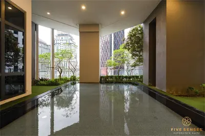 a hallway of a building with a reflecting pool at The Mews KLCC, Five Senses in Kuala Lumpur