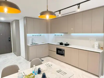 a kitchen with a table and chairs in a room at T Hotel Eaton by Klcc in Kuala Lumpur