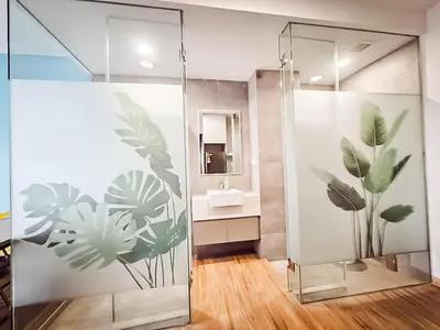 a bathroom with a shower with plants on the wall at Riveria City by Nomadnest in Kuala Lumpur