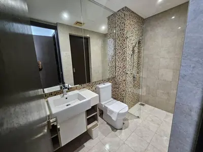 a bathroom with a sink and a toilet and a mirror at Cemara Premier Residence Ampang Near KLCC Kuala Lumpur in Kuala Lumpur