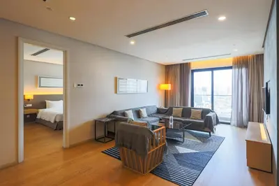a living room with a couch and a bed at 188 Suites Kuala Lumpur in Kuala Lumpur