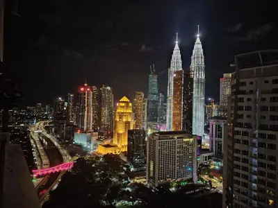 a night view of a large city with tall buildings at 188 Suites Kuala Lumpur in Kuala Lumpur