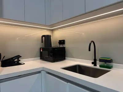a kitchen with a sink and a microwave at Alfa Bangsar By Nova Host in Kuala Lumpur