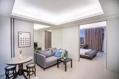 a living room with a couch and a table at Carlton, Chelsea at Plaza Damas 3, Sri Hartamas Kuala Lumpur in Kuala Lumpur
