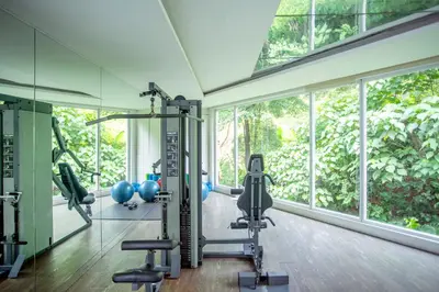a gym with tread machines and a large window at Carlton, Chelsea at Plaza Damas 3, Sri Hartamas Kuala Lumpur in Kuala Lumpur