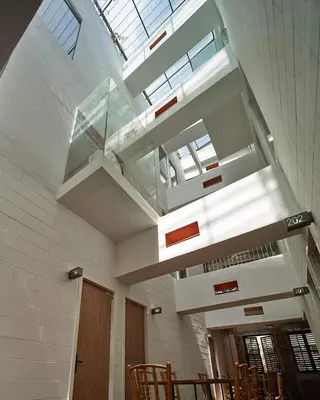 a building with a glass ceiling with a staircase at Lantern Hotel in Kuala Lumpur