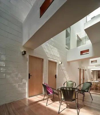 a dining room with chairs and a table at Lantern Hotel in Kuala Lumpur