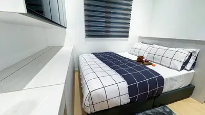 a bedroom with a bed with a teddy bear on it at M Centura Sentul Kuala Lumpur, Fully Air-Con 2-Bedroom Home in Kuala Lumpur