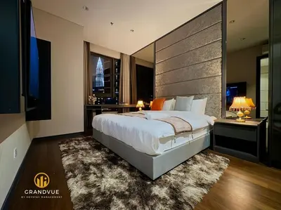a bedroom with a large bed and a large window at 8 Kia Peng Suites KLCC By HeyStay Management in Kuala Lumpur