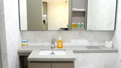 a bathroom with a sink and a mirror at Eaton KLCC Infinity Pool by NP in Kuala Lumpur