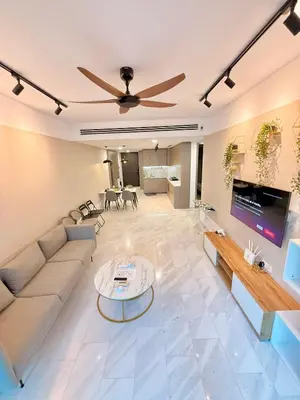 a living room with a couch and a table at Eaton KLCC Infinity Pool by NP in Kuala Lumpur