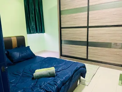 a bedroom with a blue bed and a large closet at Homestay Kuala Lumpur in Kuala Lumpur