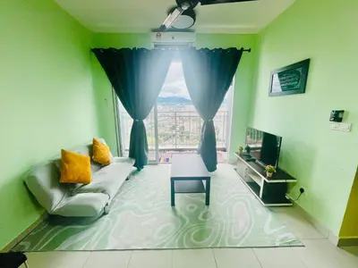 a living room with a couch and a window at Homestay Kuala Lumpur in Kuala Lumpur
