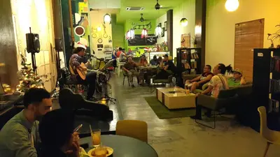 a group of people sitting in a room at PODs The Backpackers Home & Cafe, Kuala Lumpur in Kuala Lumpur