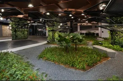 a building with a courtyard with plants in it at The Home by Fidi at Continew Residence in Kuala Lumpur