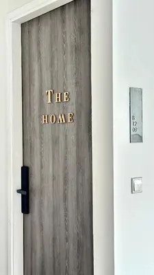 a wooden door with the house written on it at The Home by Fidi at Continew Residence in Kuala Lumpur