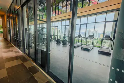 a gym with a bunch of treadmills in a building at The Atrium at Jalan Ampang by OKBnB - Beautiful 2Bedroom nearby KLCC in Kuala Lumpur