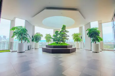 a room with several potted trees in a building at The Atrium at Jalan Ampang by OKBnB - Beautiful 2Bedroom nearby KLCC in Kuala Lumpur