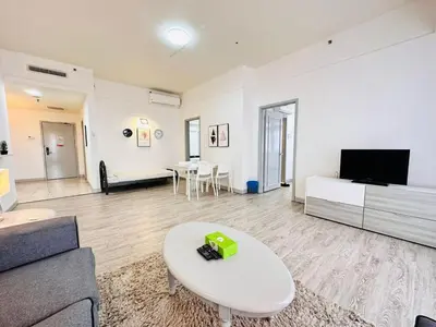 a living room with a couch and a table at KL Cozy Suite Apartment At Times Square in Kuala Lumpur