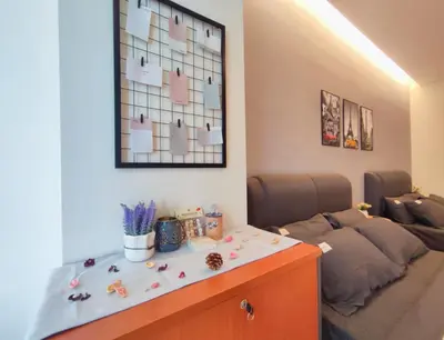 a living room with a table and a couch at KL Midvalley LRT Bangsar Modern BTC12 D in Kuala Lumpur