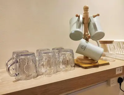 a counter with glasses and a mixer on it at KL Midvalley LRT Bangsar Modern BTC12 D in Kuala Lumpur
