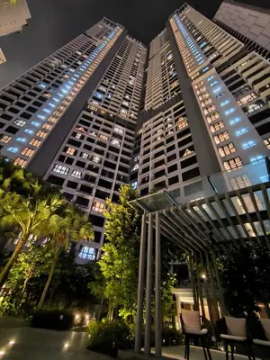 two tall buildings in a city at night at Agile Service Suites Bukit Bintang By TRX in Kuala Lumpur