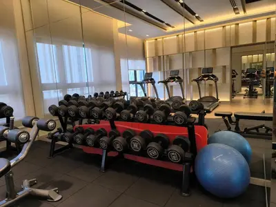 a gym with a rack of weights and machines at Agile Service Suites Bukit Bintang By TRX in Kuala Lumpur