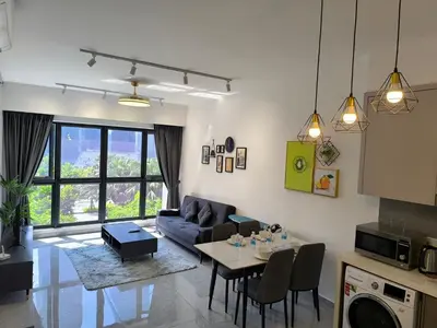 a living room with a couch and a table at Agile Service Suites Bukit Bintang By TRX in Kuala Lumpur