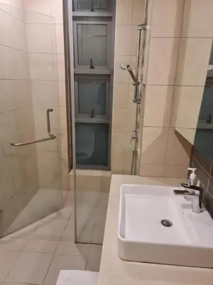 a bathroom with a sink and a shower at THE ROBERSTSON RESIDENT WITH VIEW Kuala Lumpur in Kuala Lumpur