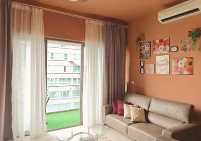 a living room with a couch and a large window at The Element Condo 3BR with KL Skyscraper View in Kuala Lumpur