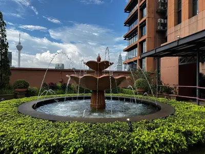 a water fountain in the middle of a building at Times Square Service Suites KL, Fortune in Kuala Lumpur