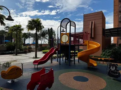 a playground with a slide in a park at Times Square Service Suites KL, Fortune in Kuala Lumpur