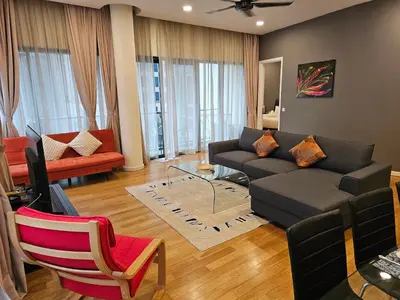 a living room with a couch and a tv at Urban Oasis at St Mary klcc 1Bed2bath in Kuala Lumpur