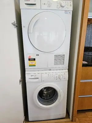 a white washer and dryer in a room at Urban Oasis at St Mary klcc 1Bed2bath in Kuala Lumpur